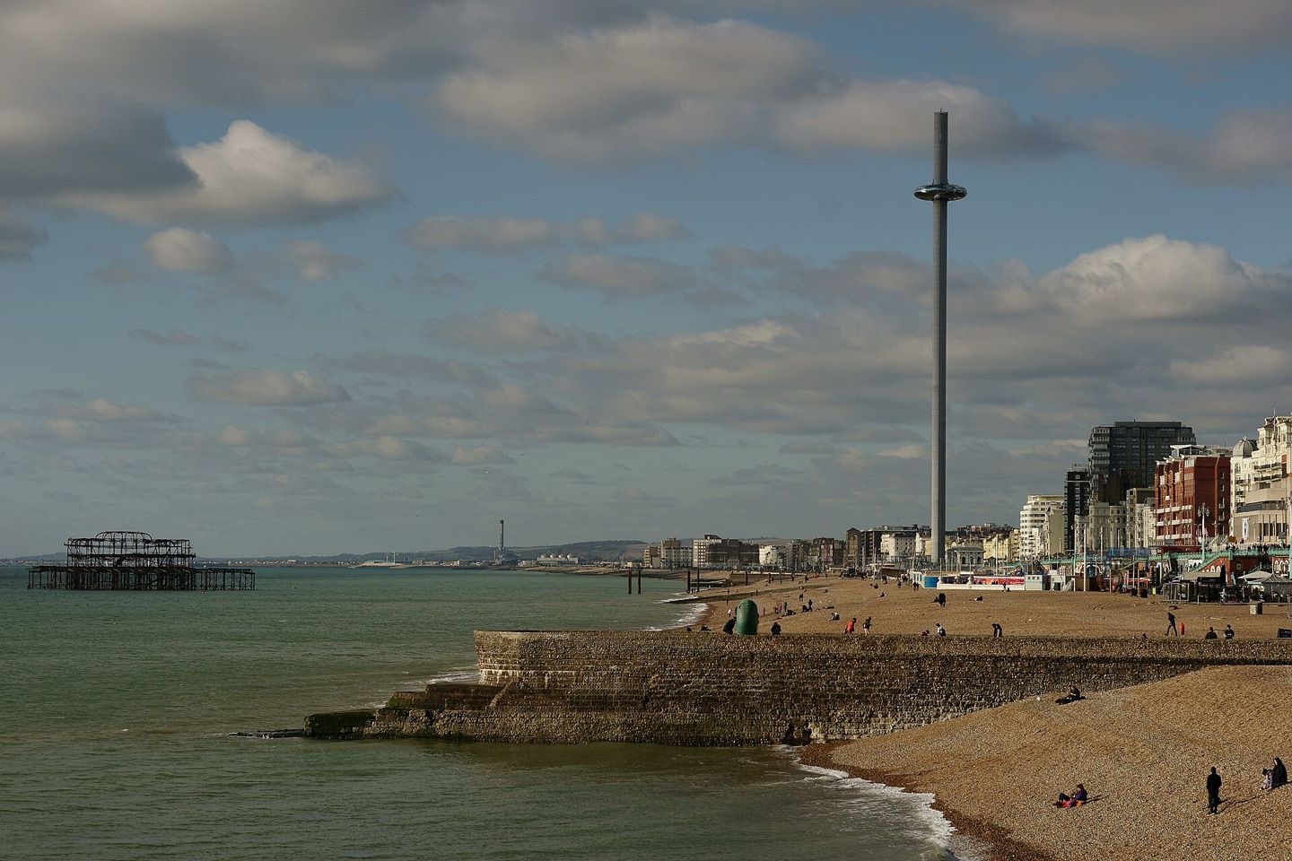 Brighton seafront and beach, with the ruins of the West Pier and the i360 tower