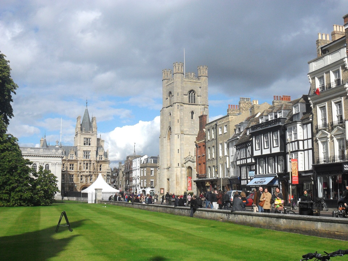 King's Parade in Cambridge, with Great St Mary's Church tower, shops and the lawn of King's College