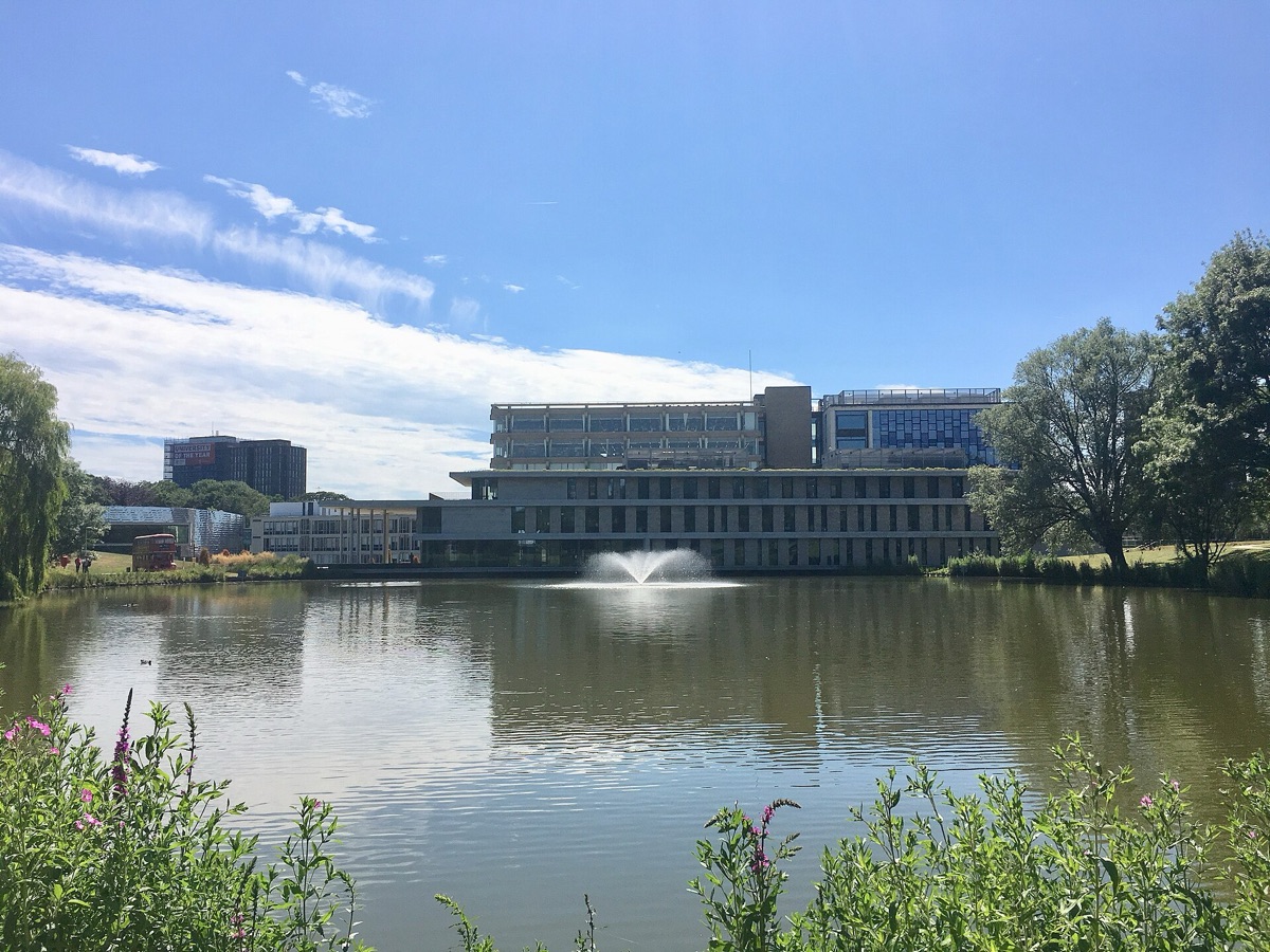 The lake and fountain on the University of Essex Colchester campus, with the Silberrad Student Centre behind