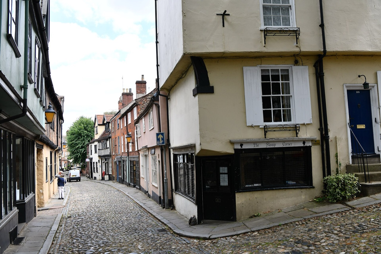 Elm Hill in Norwich, a cobbled street lined with historic timber-framed houses